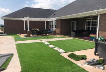A backyard with fresh turf installed by Hobgood